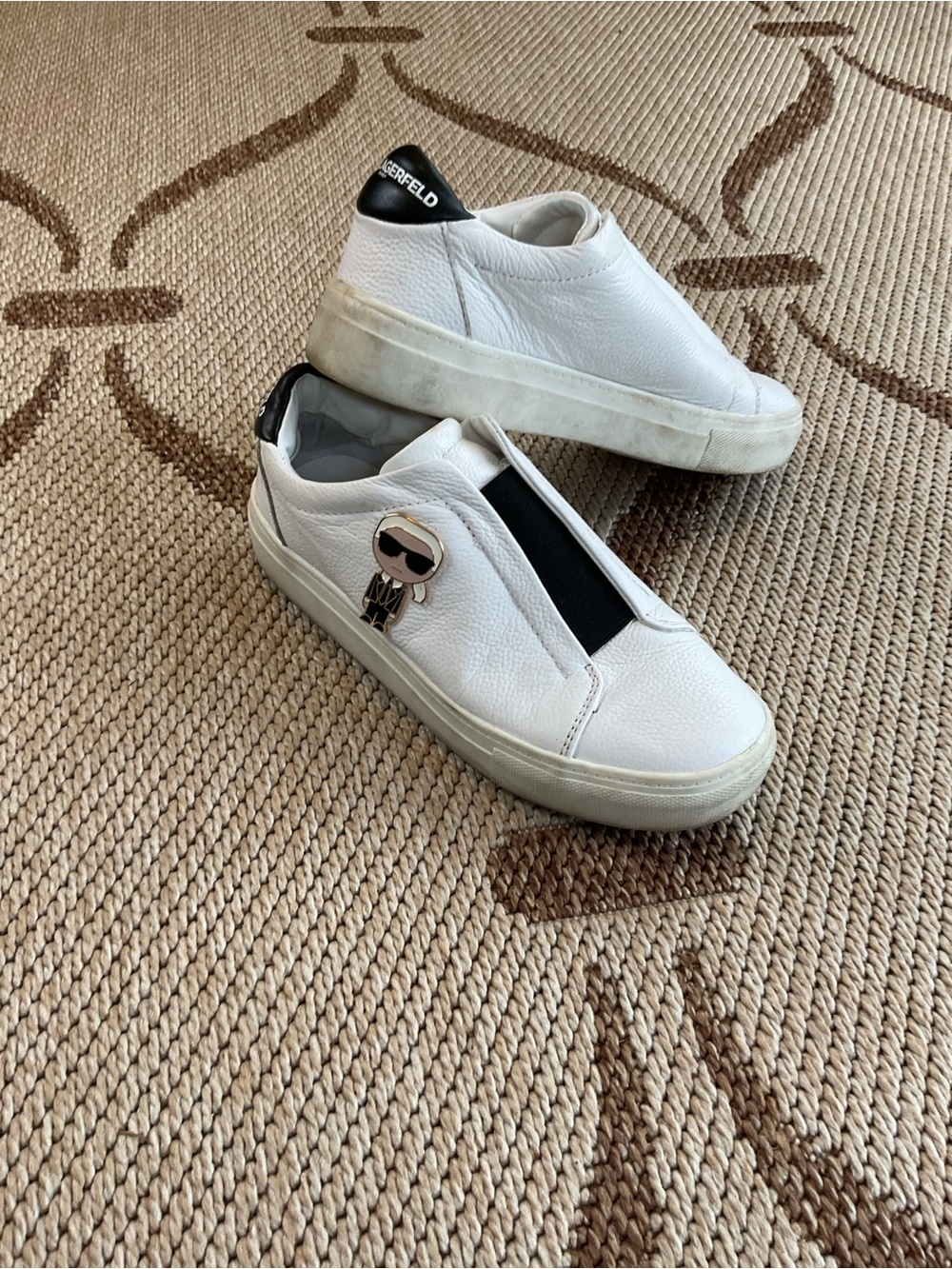 Karl Lagerfeld White Slip-On Sneakers with Black Heel Tab and Gold Charm